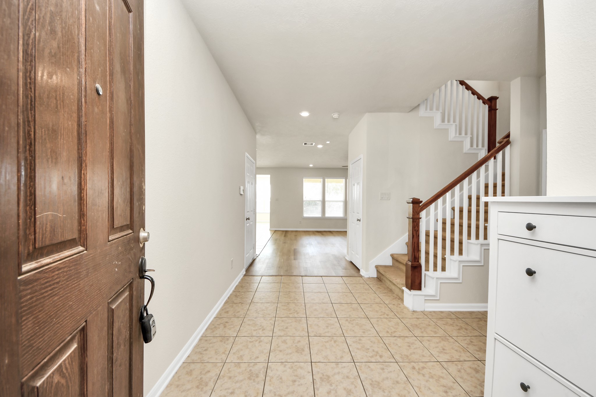 24123 Adobe Ridge Lane Katy, TX 77493 - Photo 7 of 45 a view of a hallway with windows and stairs