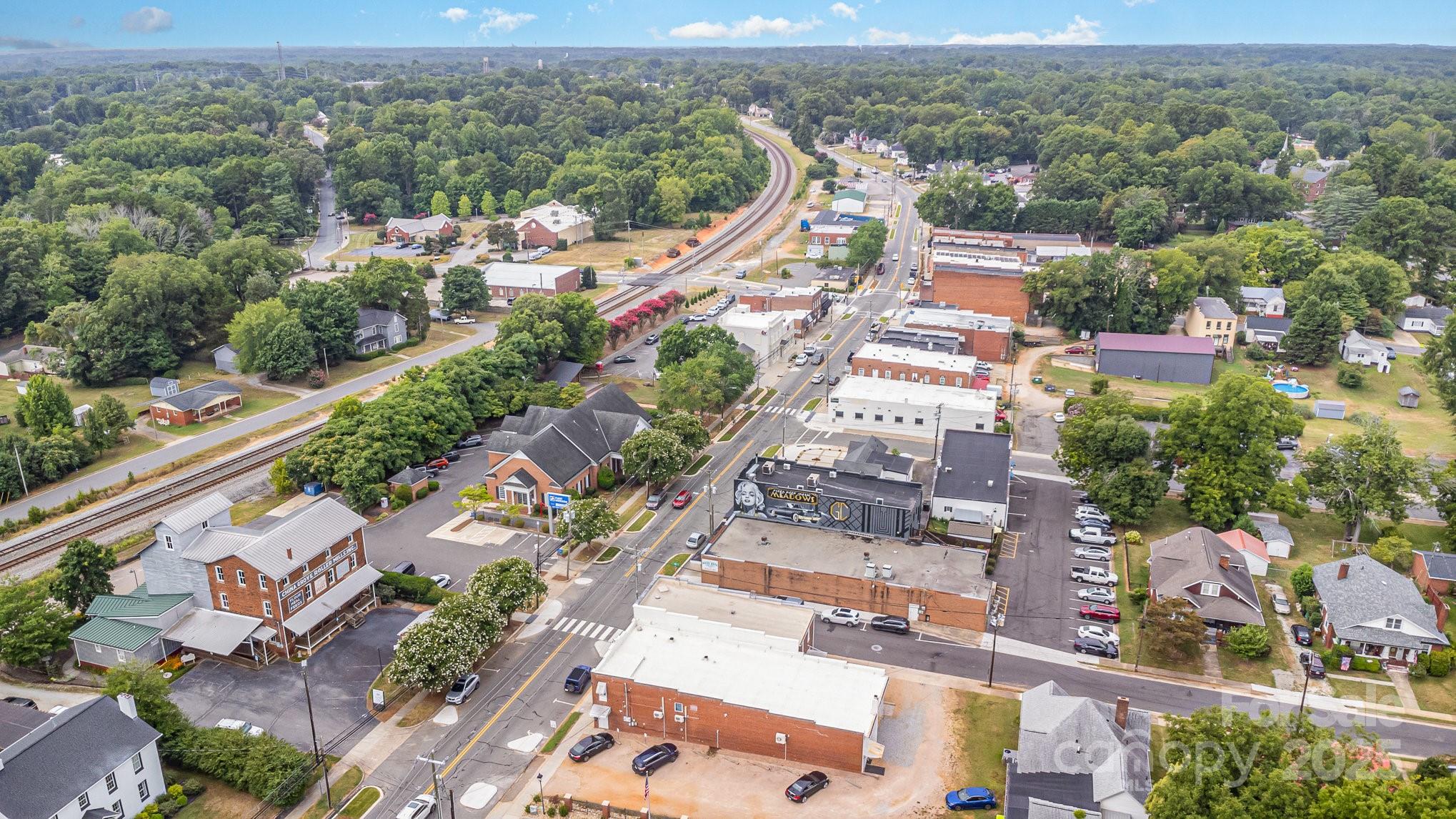 633 Patterson Street China Grove, NC 28023 - Photo 6 of 8 an aerial view of a city with lots of residential buildings