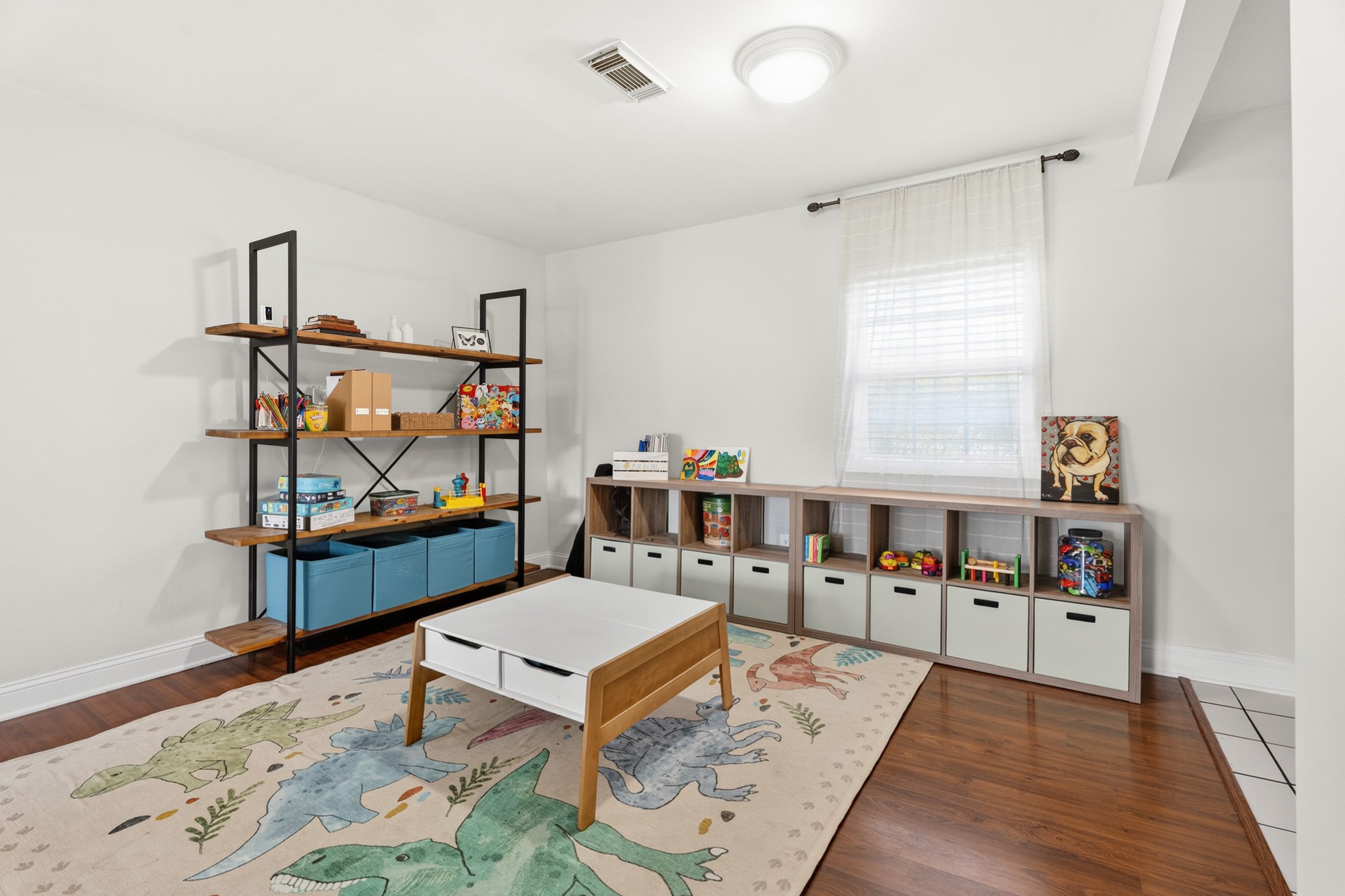 2104 Rose Road Pearland, TX 77581 - Photo 20 of 43 a living room with furniture a rug and a window
