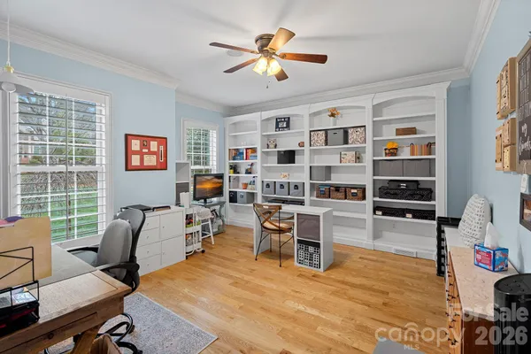 a living room with furniture a rug and a large window