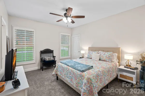 a bedroom with a bed and a couch