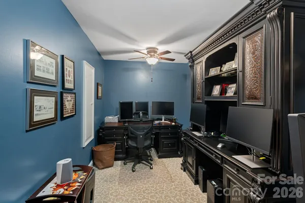 a workspace with furniture and window