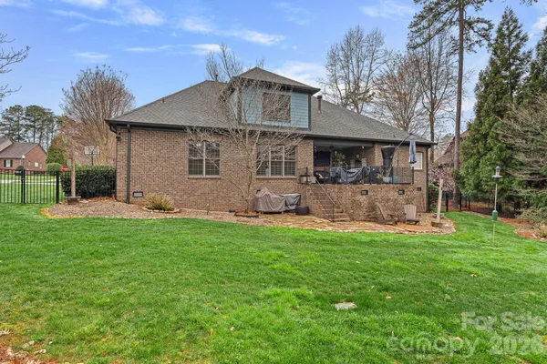 a front view of a house with a yard and porch