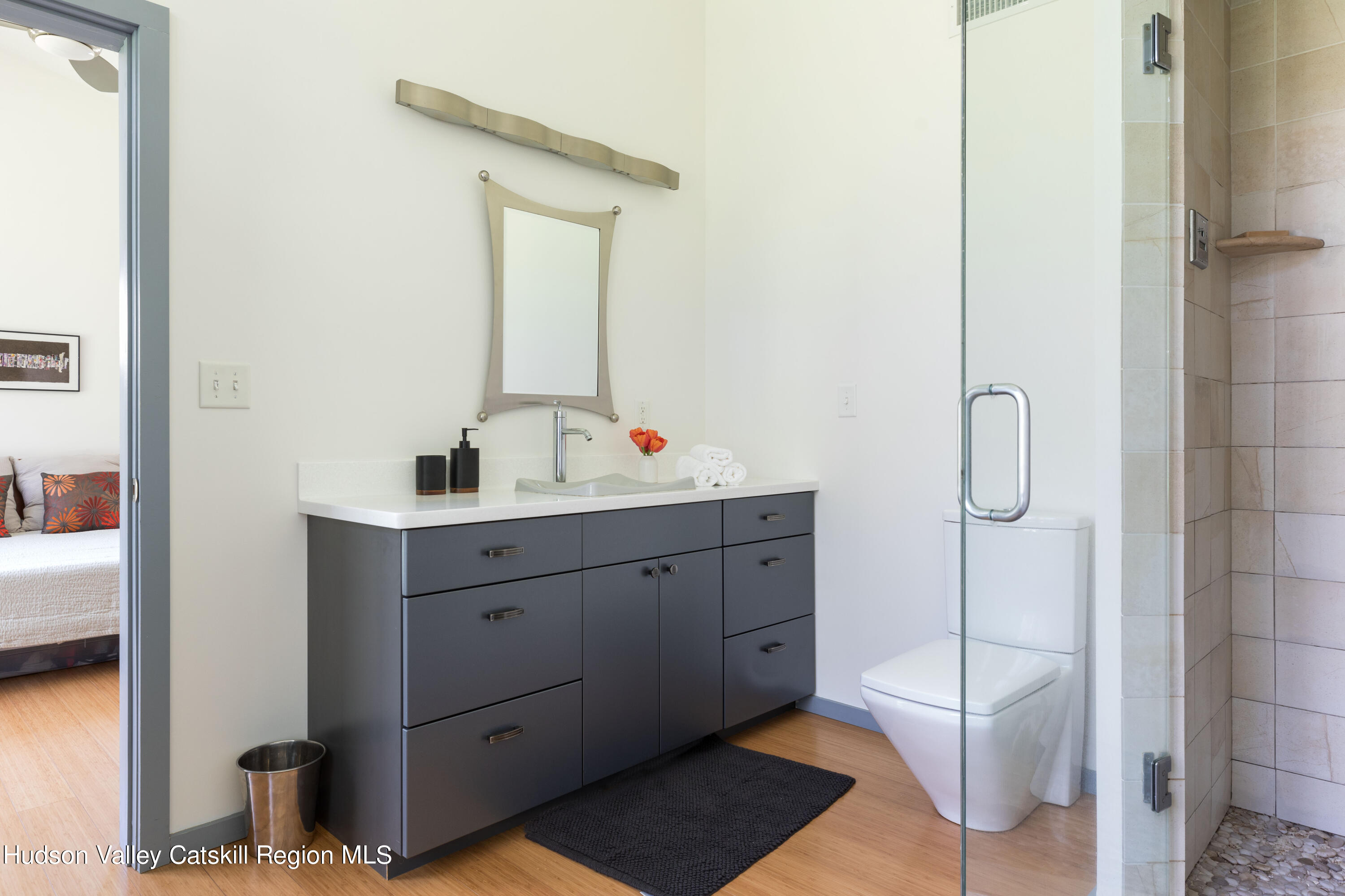 177 Stillwater Road Stone Ridge, NY 12484 - Photo 12 of 27 a en suite bathroom with a double vanity sink a mirror and a shower