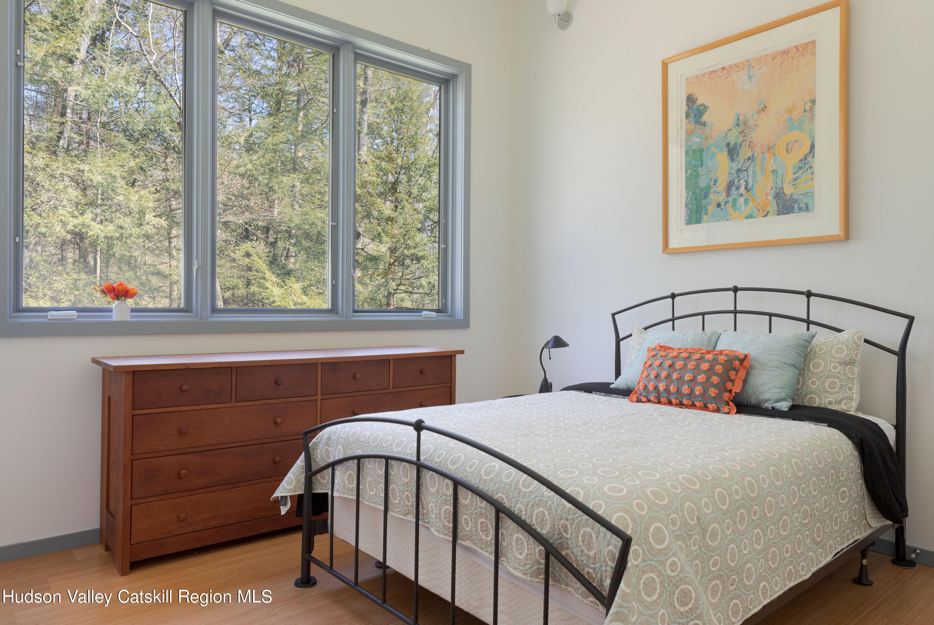 177 Stillwater Road Stone Ridge, NY 12484 - Photo 16 of 27 a bedroom with a bed a dresser next to a window