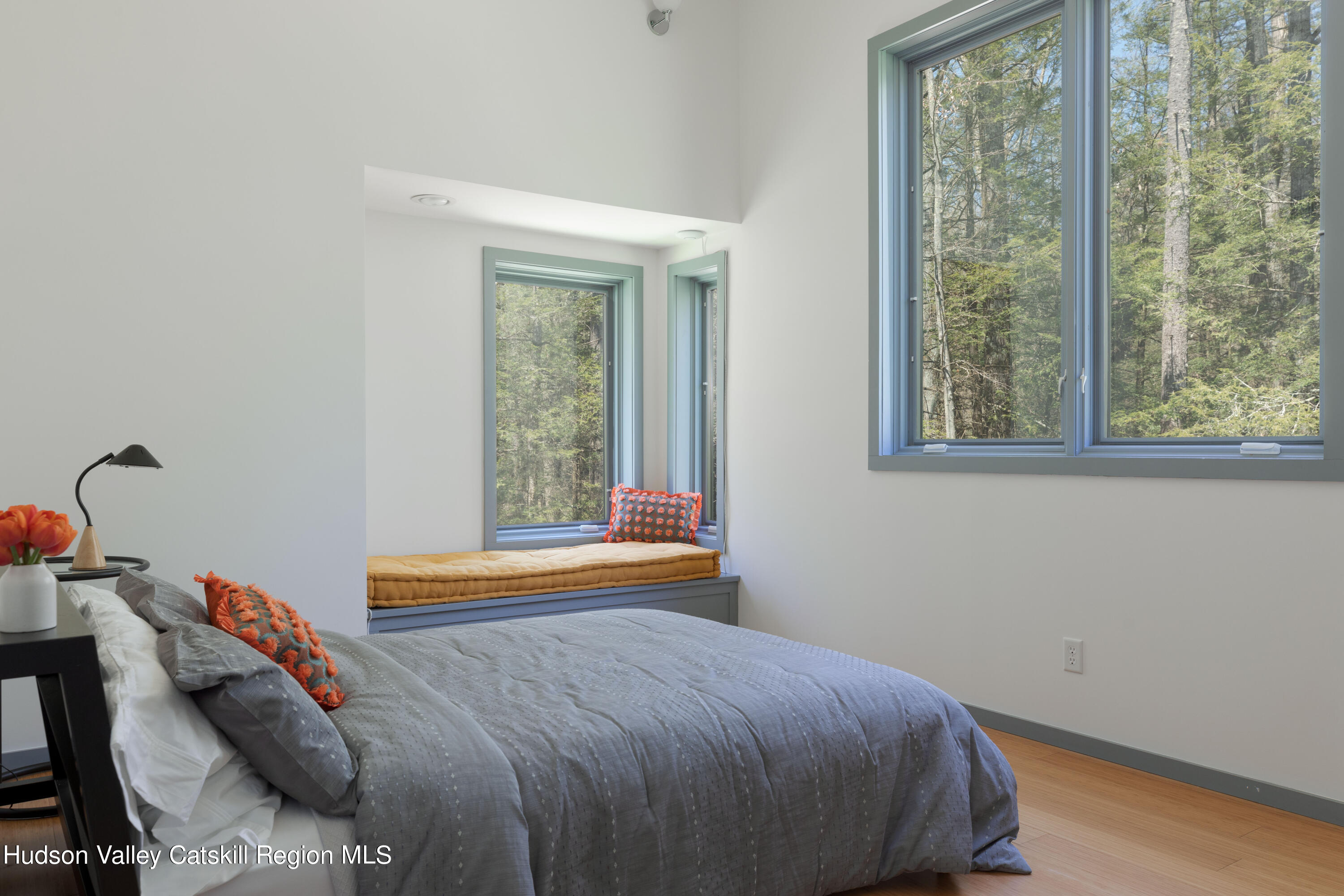 177 Stillwater Road Stone Ridge, NY 12484 - Photo 17 of 27 a bed sitting in a bedroom next to a window