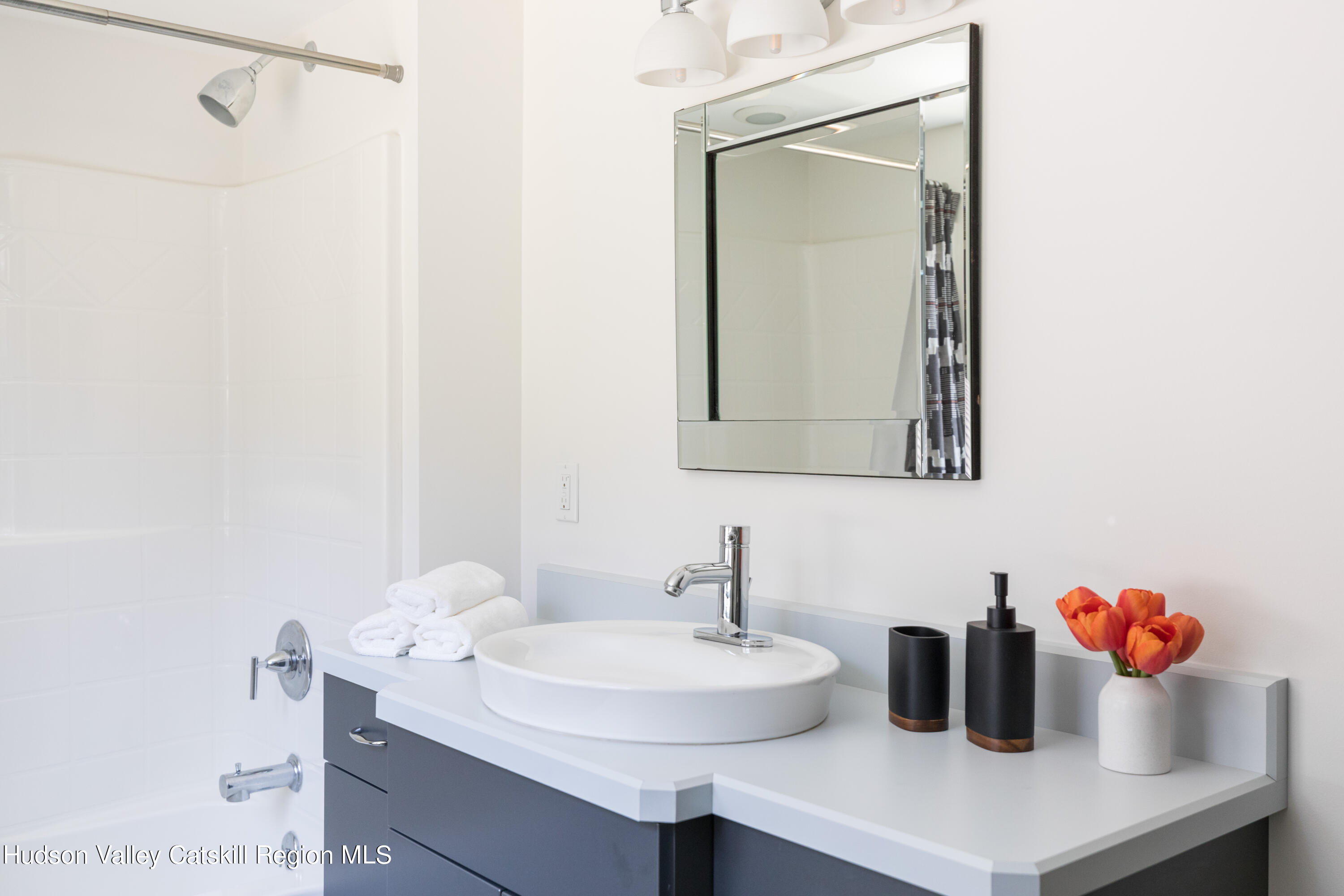 177 Stillwater Road Stone Ridge, NY 12484 - Photo 18 of 27 a bathroom with a sink and a mirror