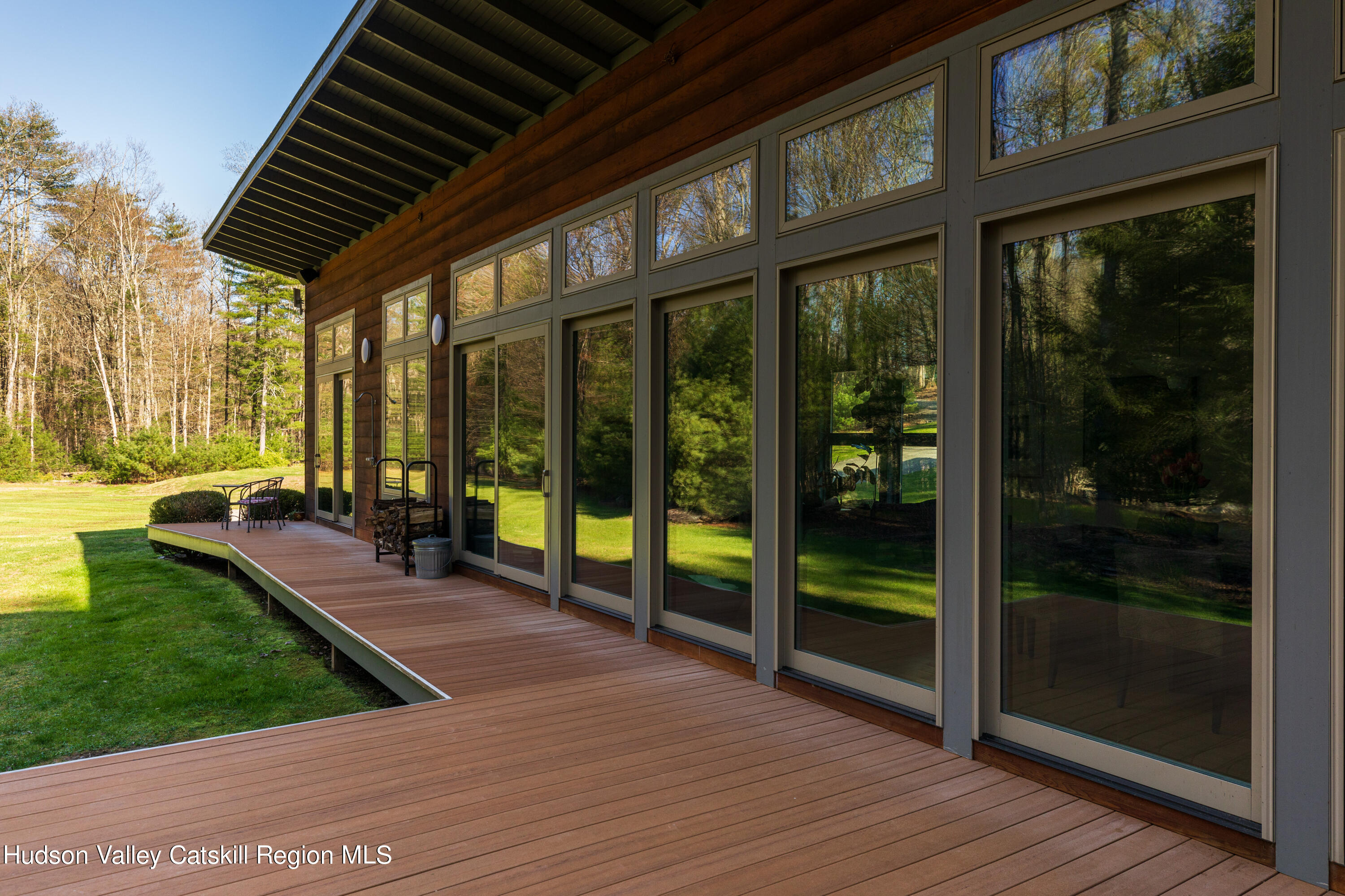 177 Stillwater Road Stone Ridge, NY 12484 - Photo 2 of 27 a view of a porch with wooden floor and garden