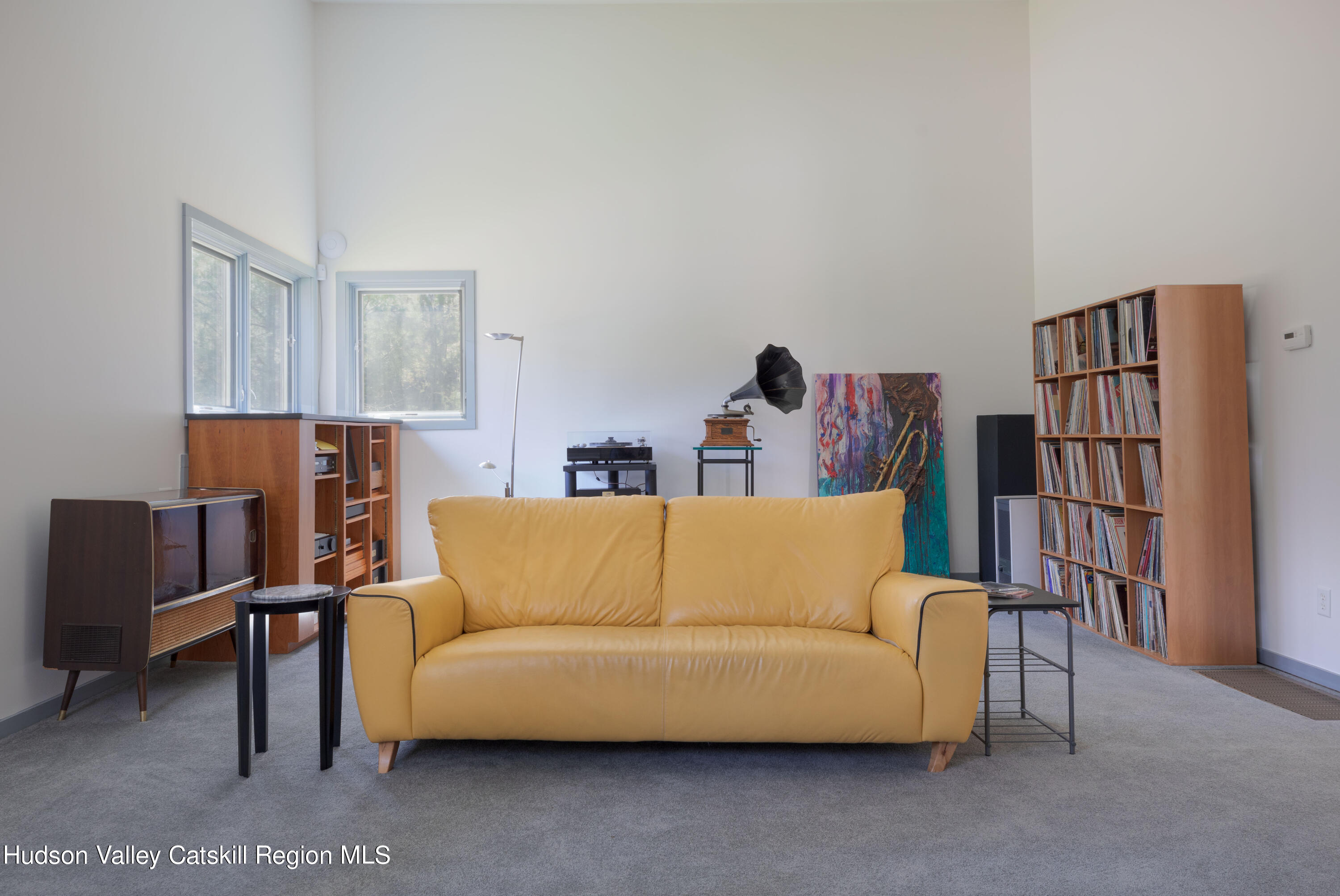 177 Stillwater Road Stone Ridge, NY 12484 - Photo 22 of 27 a living room with furniture and a shelf