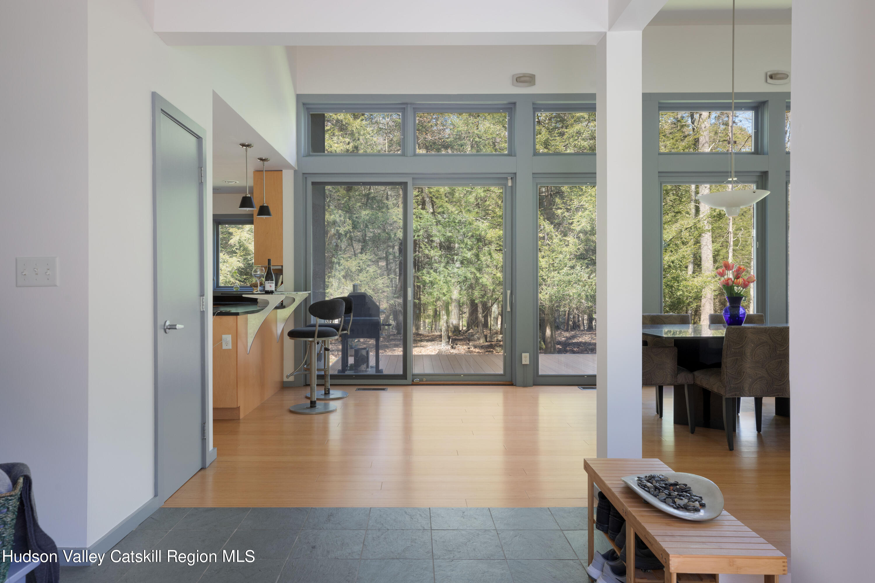 177 Stillwater Road Stone Ridge, NY 12484 - Photo 3 of 27 a living room with furniture and a floor to ceiling window