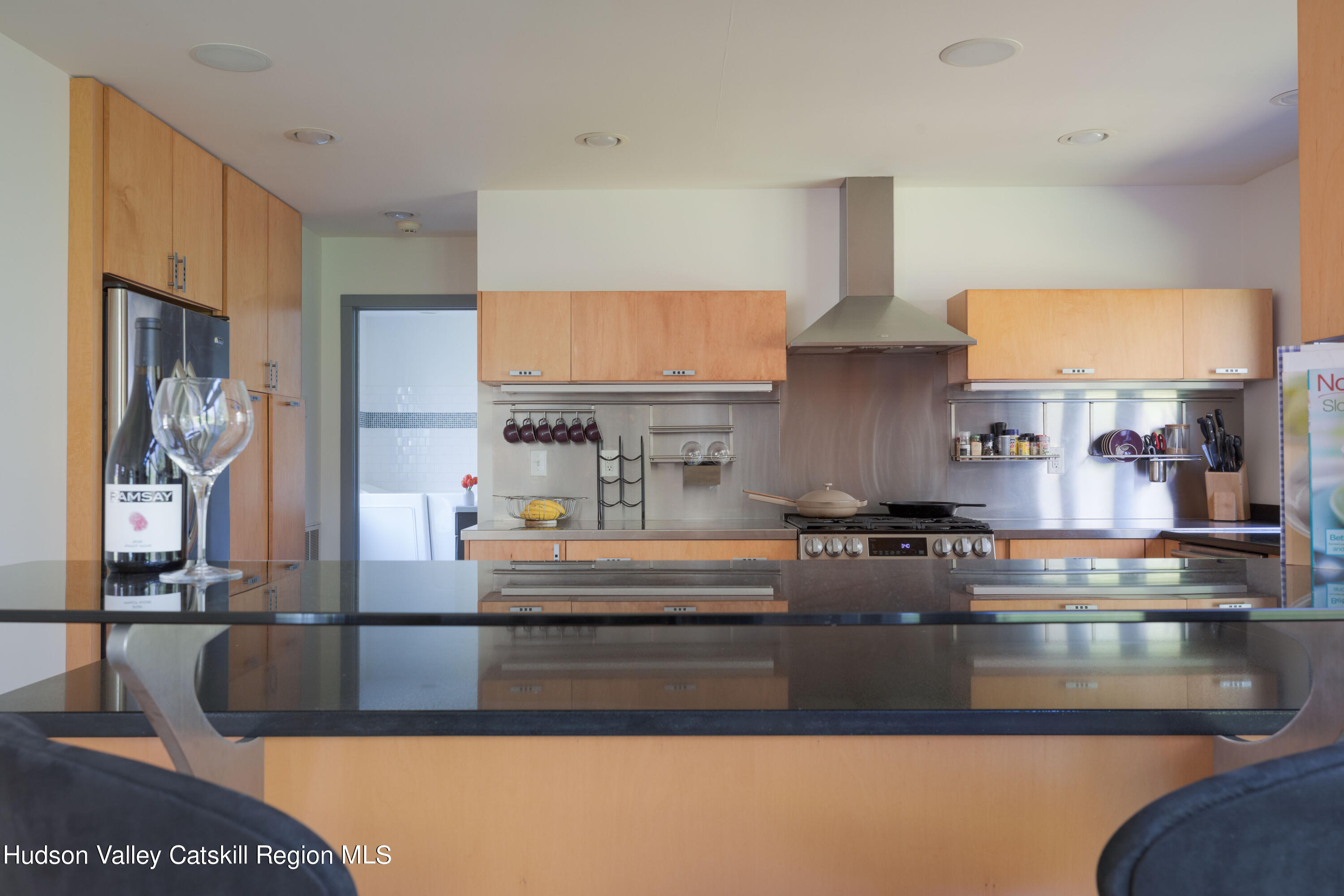 177 Stillwater Road Stone Ridge, NY 12484 - Photo 8 of 27 a kitchen with kitchen island granite countertop a stove and a sink