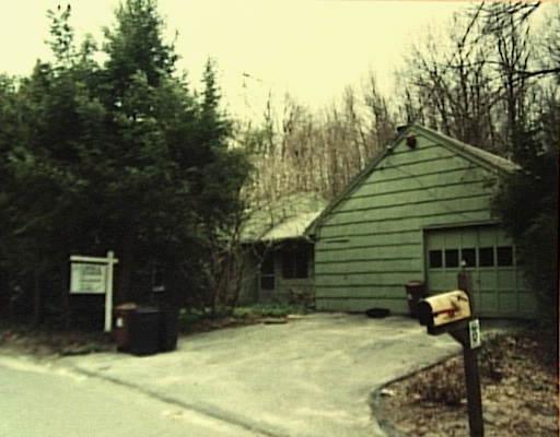 20 Saw Mill Road Newtown, CT 06470 - Photo 1 of 1 a yellow house with trees in front of it
