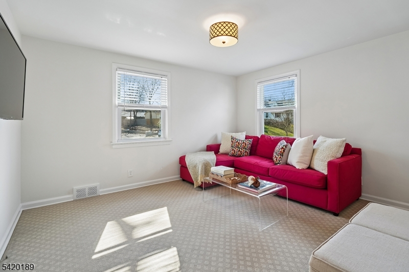 8 Edison Drive Summit, NJ 07901 - Photo 13 of 34 a living room with furniture and a window