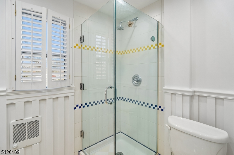 8 Edison Drive Summit, NJ 07901 - Photo 19 of 34 a bathroom with a shower a toilet and a sink