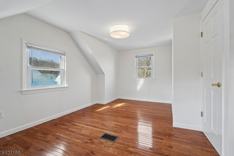 8 Edison Drive Summit, NJ 07901 - Photo 21 of 34 a view of empty room with wooden floor and fan