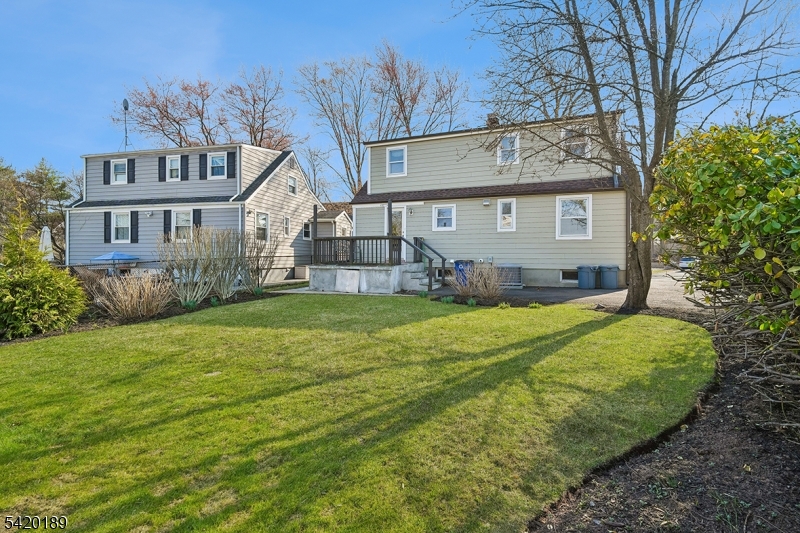8 Edison Drive Summit, NJ 07901 - Photo 33 of 34 a view of a house with a big yard and large tree