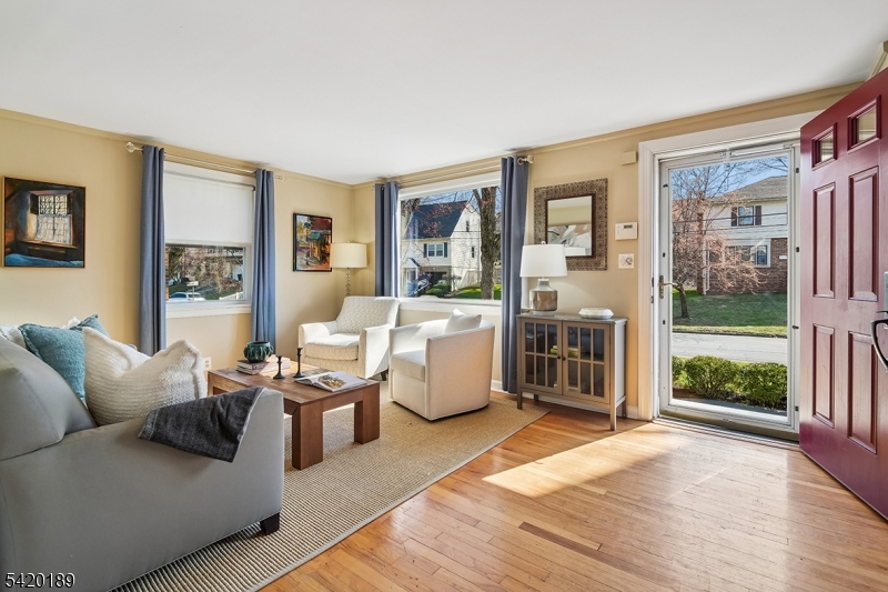 8 Edison Drive Summit, NJ 07901 - Photo 5 of 34 a living room with furniture and a floor to ceiling window