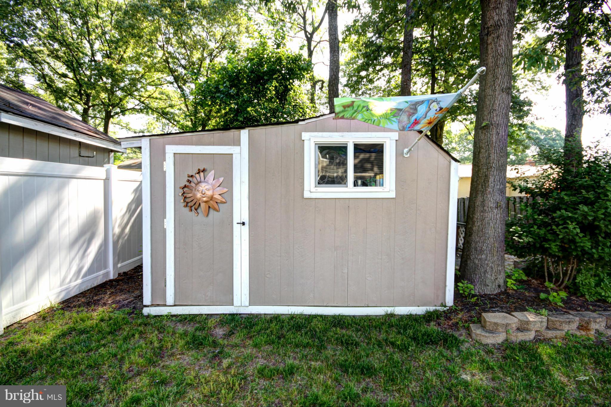 7707 Mahogany Road Severn, MD 21144 - Photo 29 of 30 a view of a small house with a tree