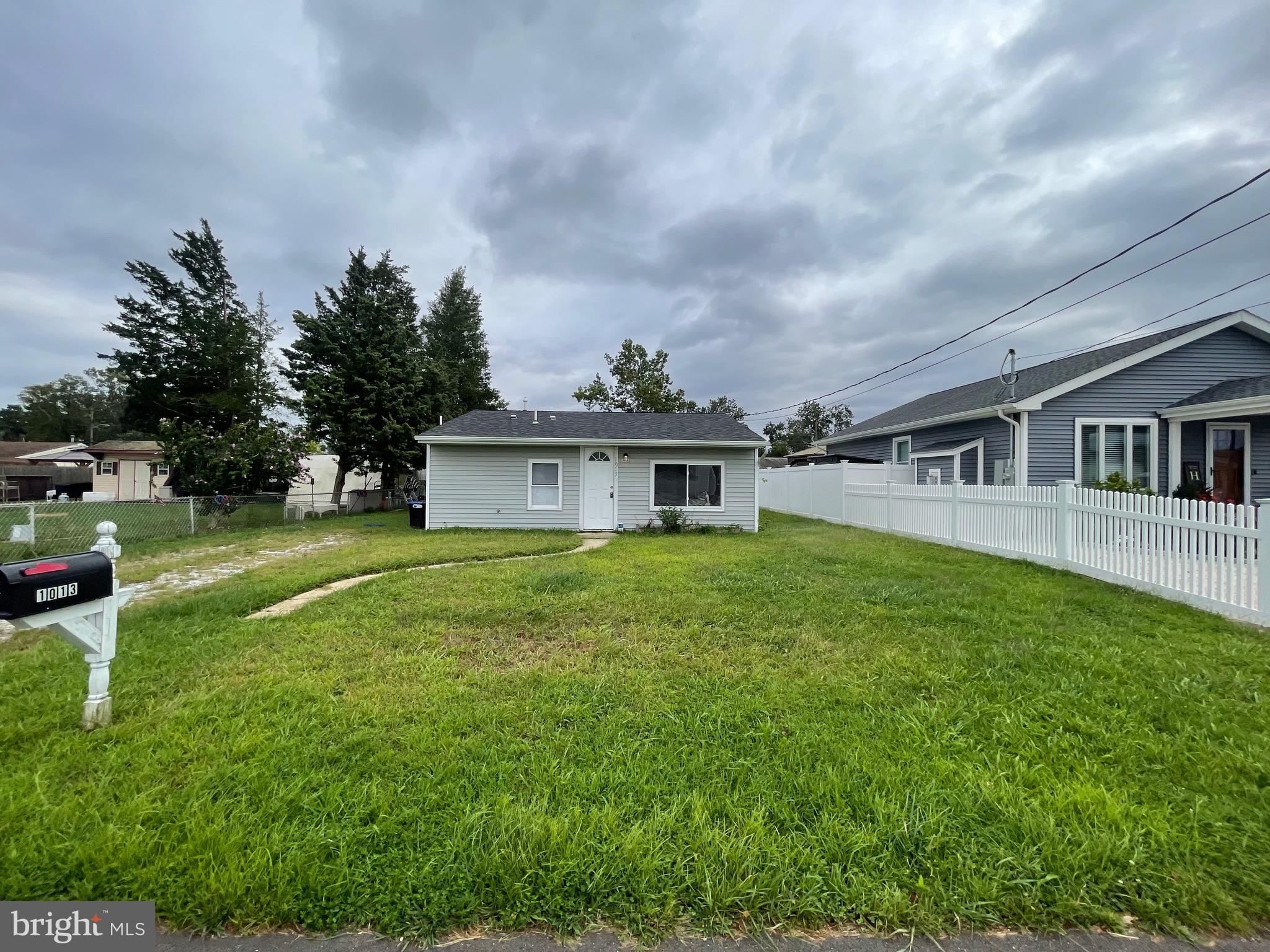 1013 Anchor Way Forked River, NJ 08731 - Photo 1 of 10 a front view of a house with garden