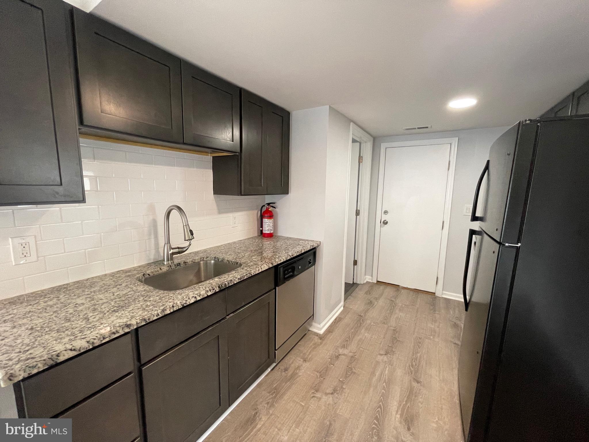 1013 Anchor Way Forked River, NJ 08731 - Photo 7 of 10 a kitchen with granite countertop stainless steel appliances a sink and refrigerator