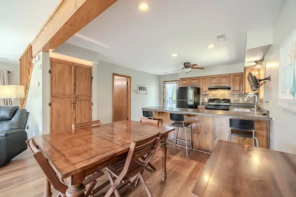 a view of a dining room with furniture and wooden floor