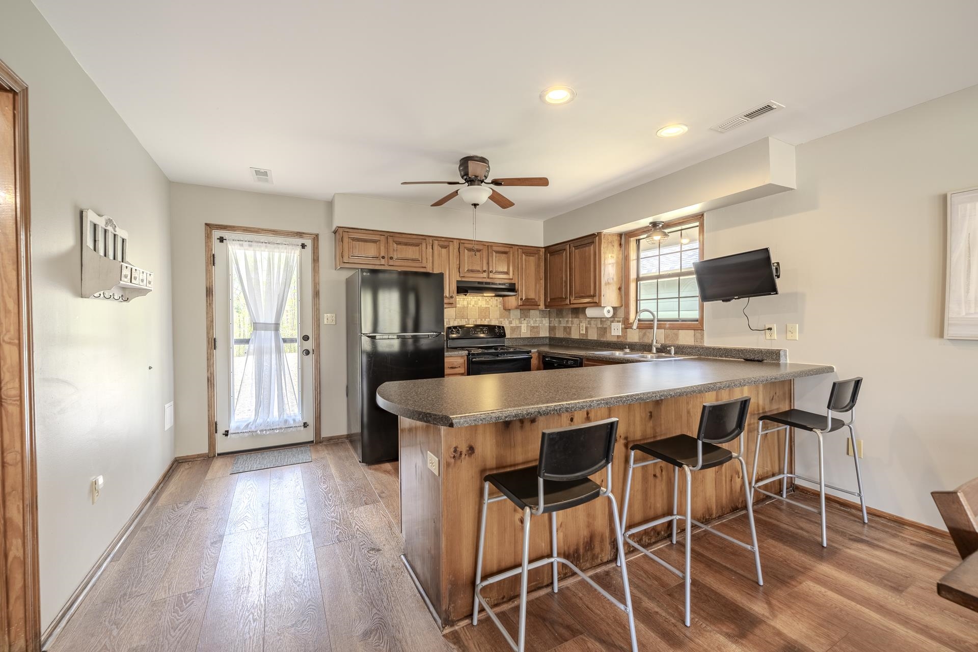 1085 Old Road Counce, TN 38326 - Photo 16 of 30 a kitchen with stainless steel appliances kitchen island granite countertop a dining table chairs and granite counter tops