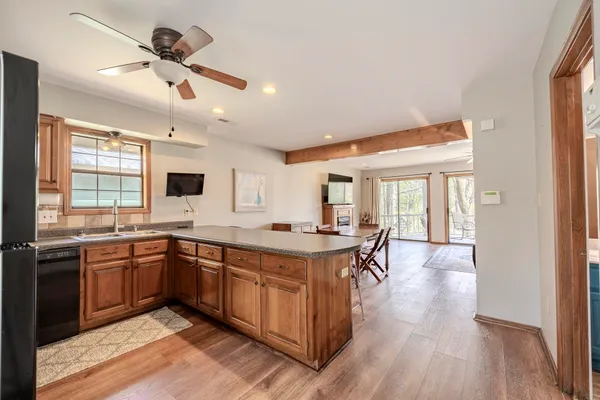 a kitchen with stainless steel appliances granite countertop a stove and a sink
