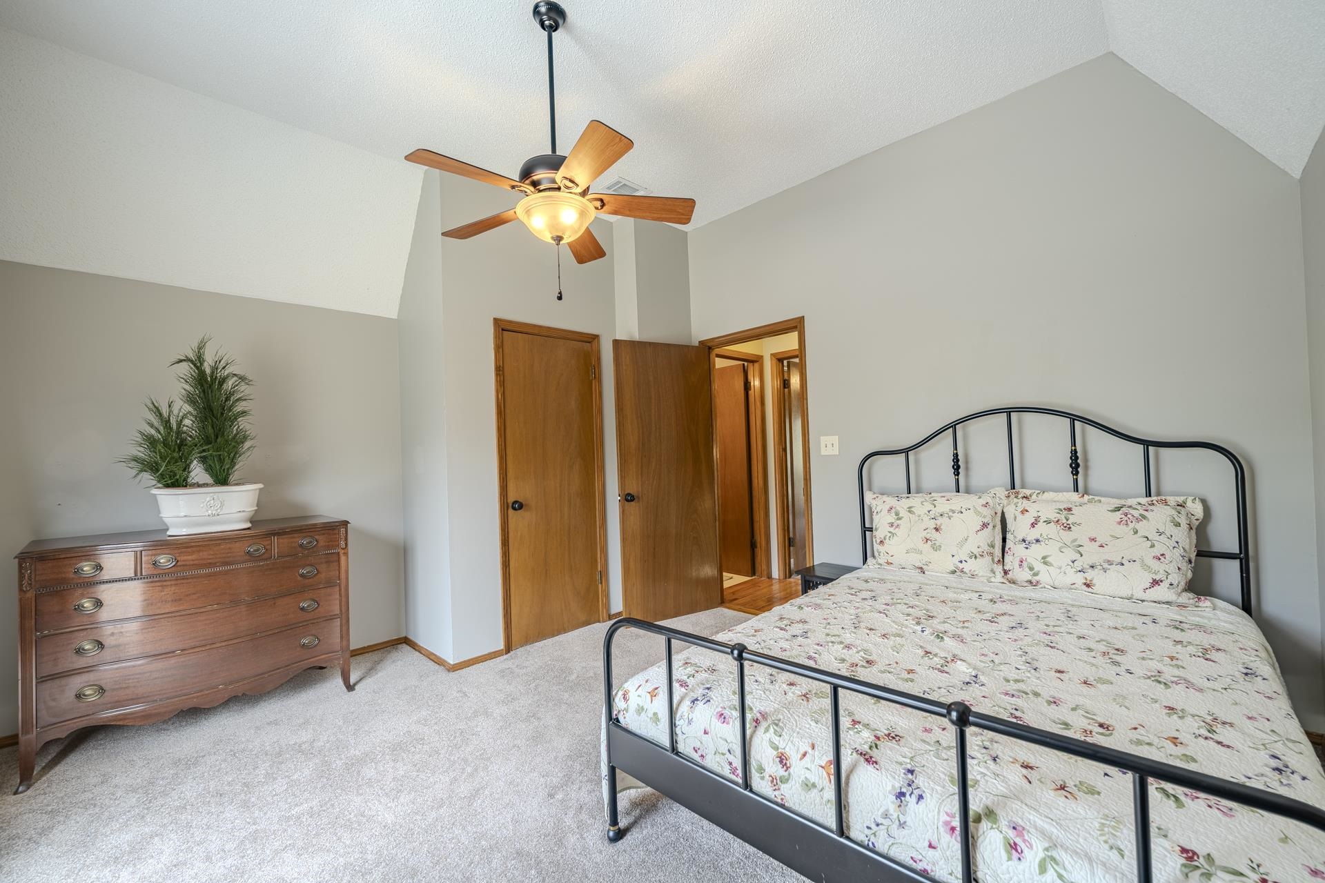 1085 Old Road Counce, TN 38326 - Photo 20 of 30 a bedroom with a bed and a chandelier