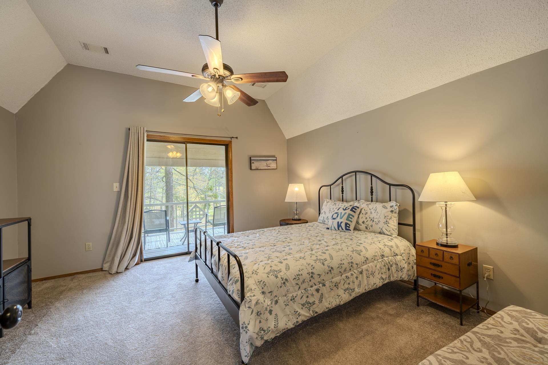 1085 Old Road Counce, TN 38326 - Photo 22 of 30 a bedroom with a bed and a chandelier
