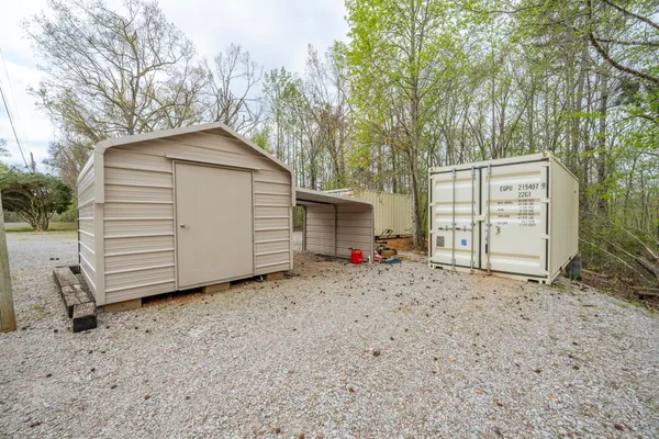 a view of a house with a yard and garage