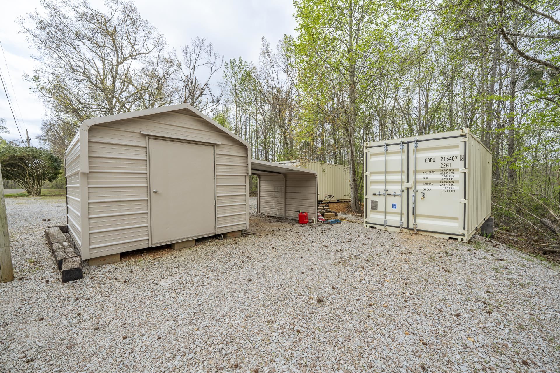 1085 Old Road Counce, TN 38326 - Photo 26 of 30 a view of a house with a yard and garage