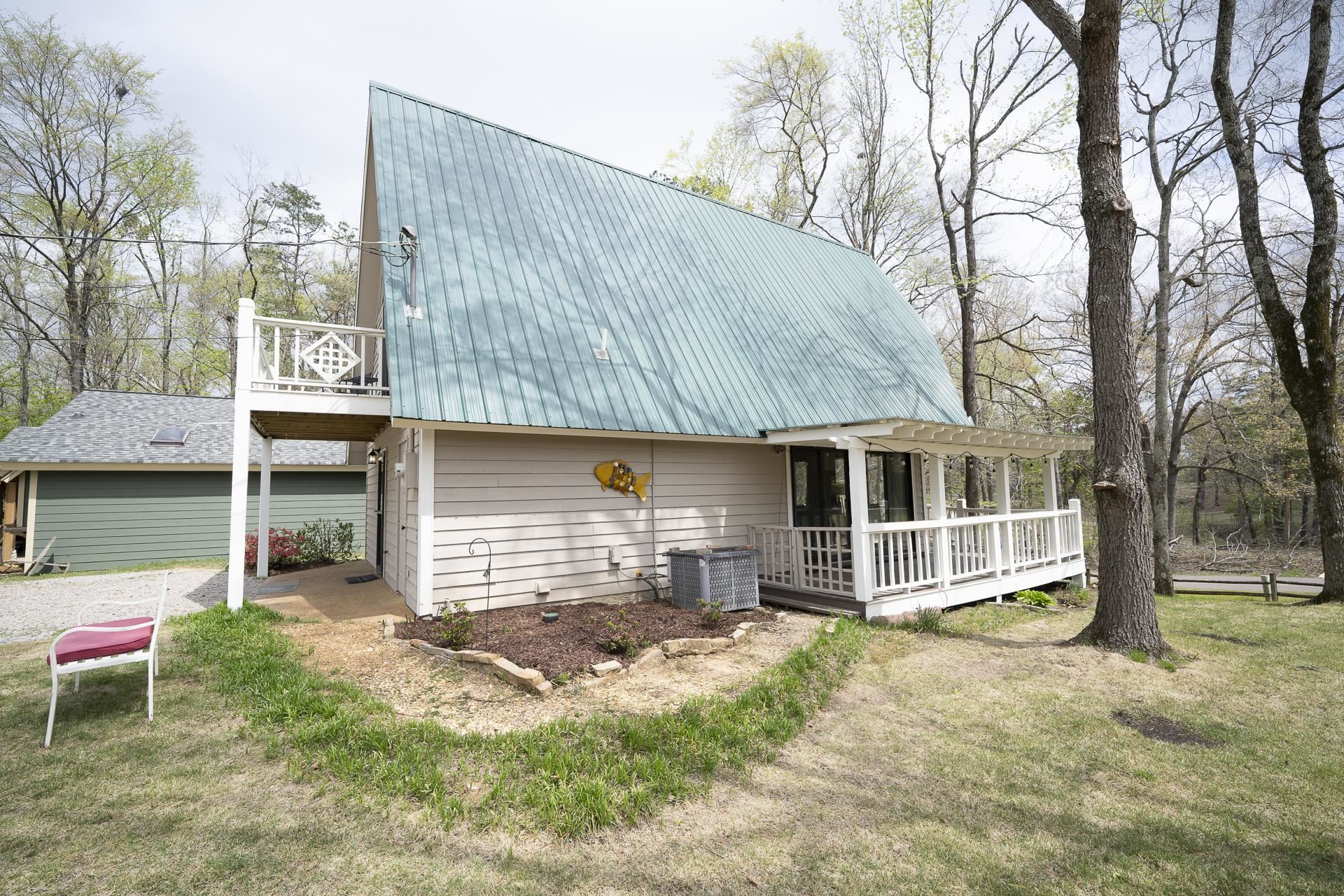 1085 Old Road Counce, TN 38326 - Photo 27 of 30 a front view of a house with a yard and garage