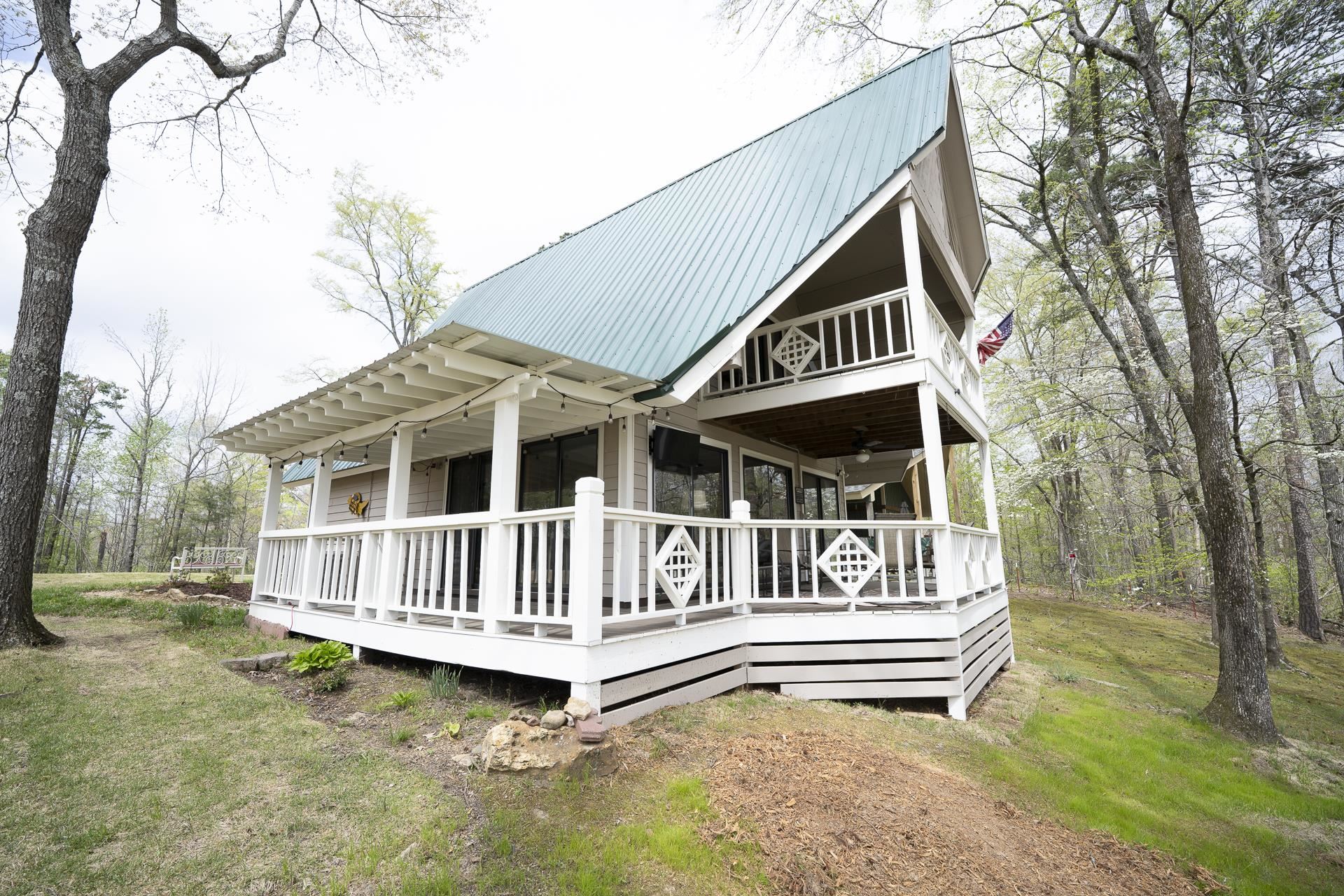 1085 Old Road Counce, TN 38326 - Photo 28 of 30 a view of a house with a wooden deck and a yard