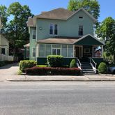 front view of a house with a small yard