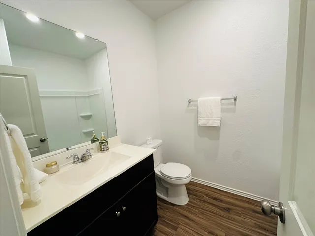 a view of hallway with wooden floor