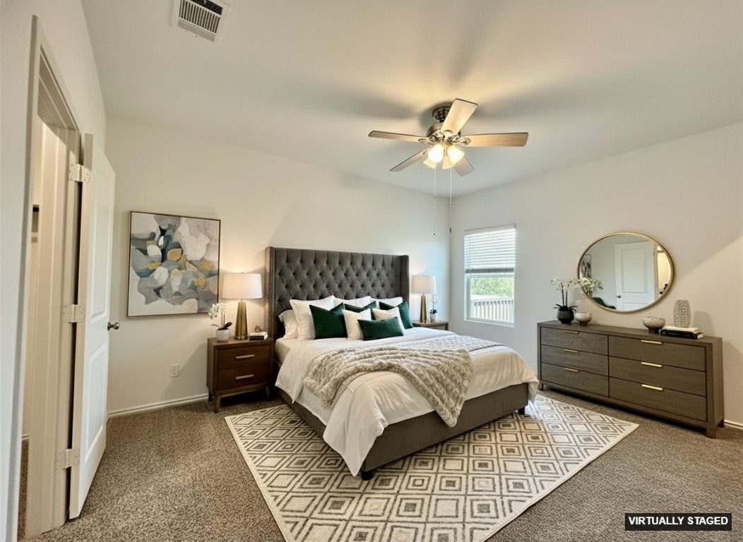 13410 Mussel Run Elgin, TX 78621 - Photo 16 of 32 a bedroom with a bed and a chandelier