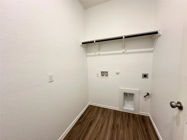 a bathroom with a sink a toilet a mirror and shower