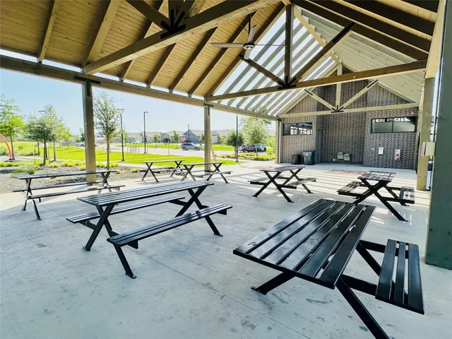 a view of a swimming pool with outdoor seating