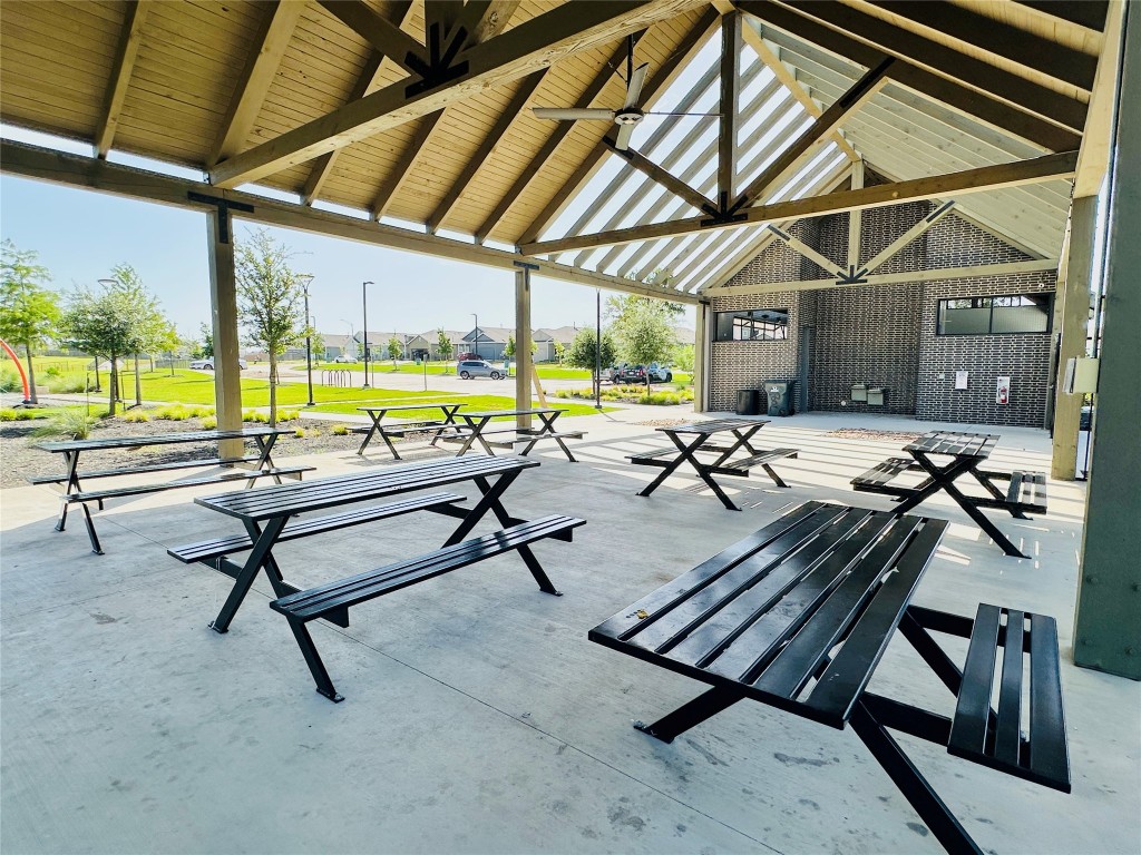 13410 Mussel Run Elgin, TX 78621 - Photo 28 of 32 a view of a swimming pool with outdoor seating