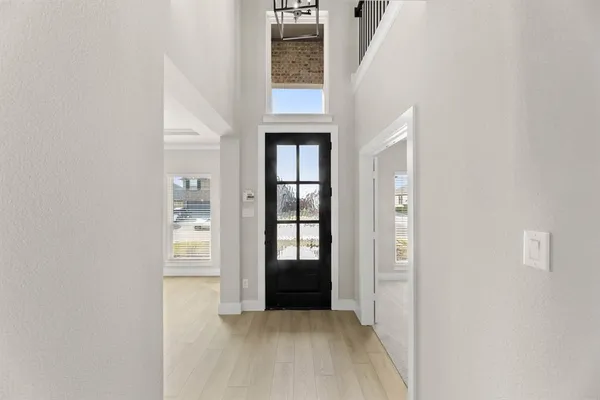 view of an entryway with wooden floor and door