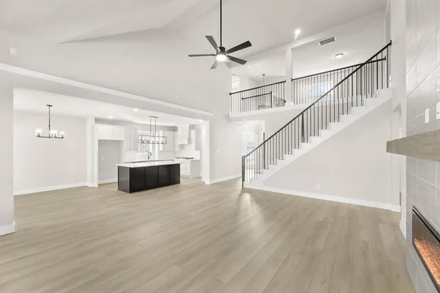 a view of kitchen with sink and wooden floor