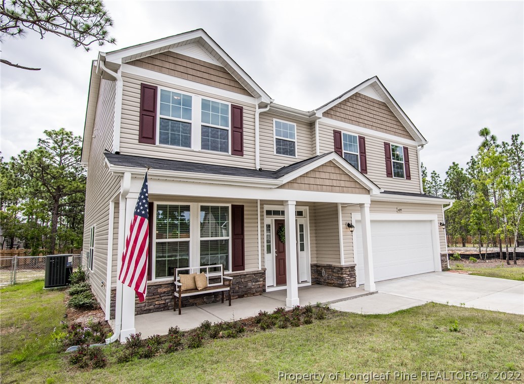 a front view of a house with a yard and porch
