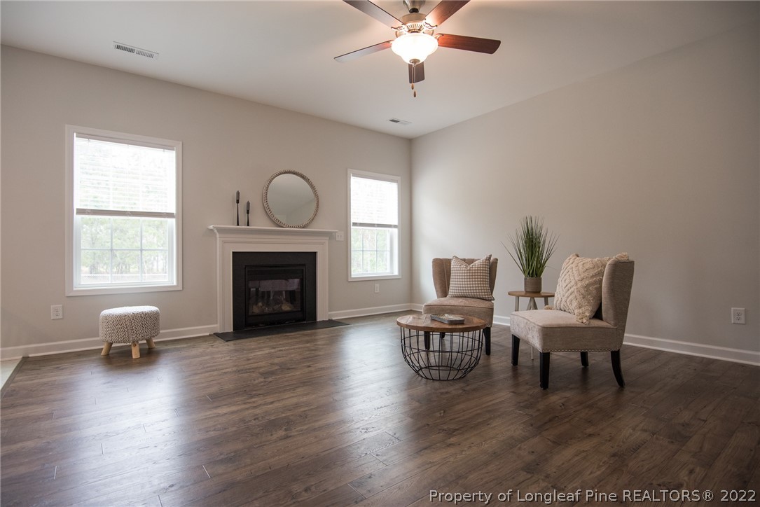 4095 Irwin Drive Aberdeen, NC 28315 - Photo 24 of 50 a living room with furniture and a fireplace
