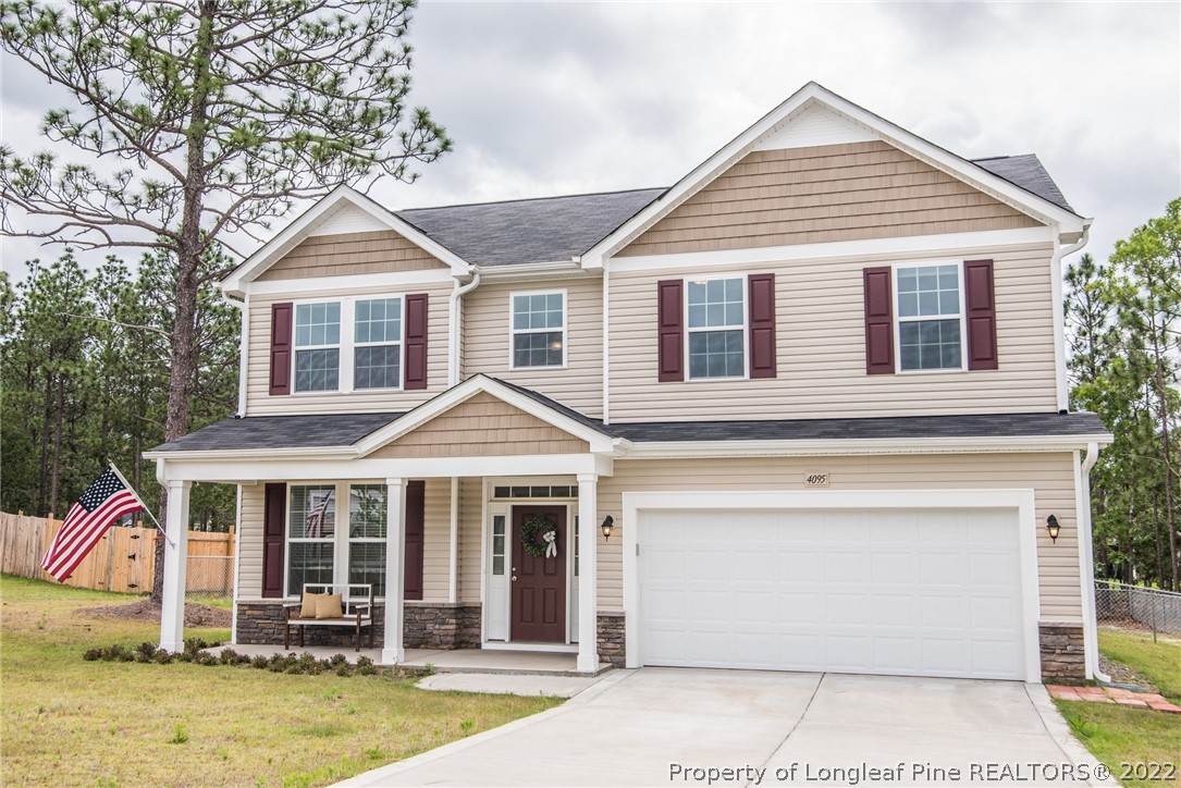4095 Irwin Drive Aberdeen, NC 28315 - Photo 3 of 50 a front view of a house with garden