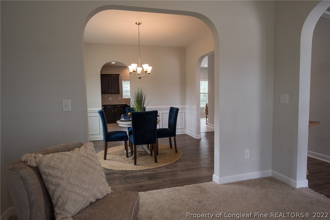 4095 Irwin Drive Aberdeen, NC 28315 - Photo 9 of 50 a dining room with furniture and a mirror