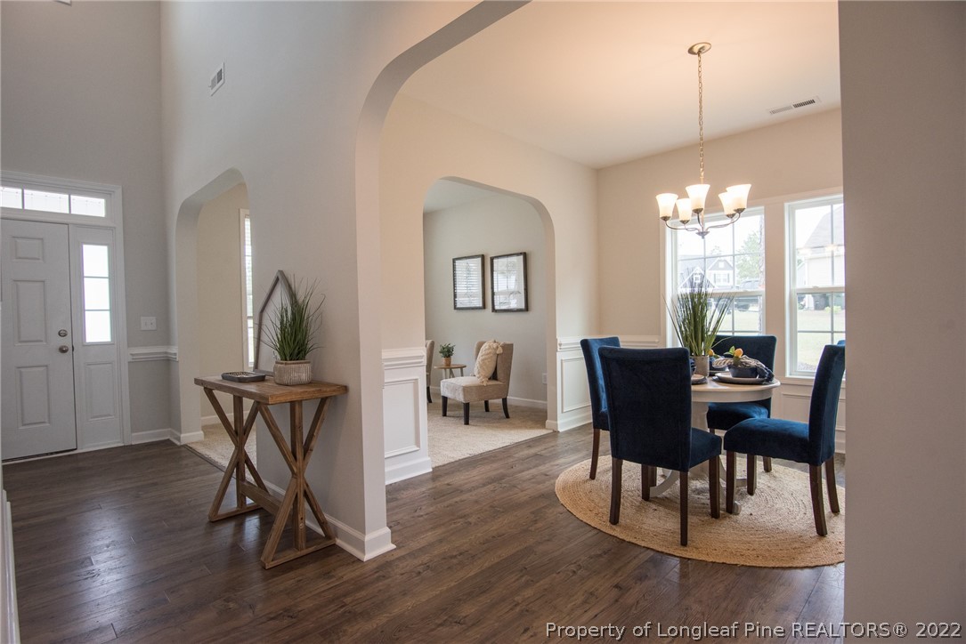 4095 Irwin Drive Aberdeen, NC 28315 - Photo 10 of 50 a view of a dining room with furniture window and wooden floor