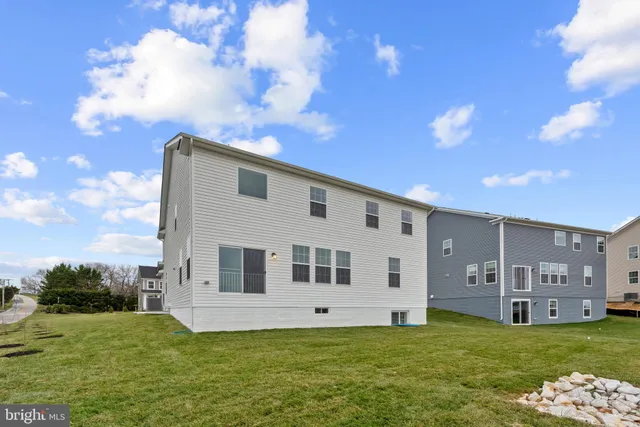 a house view with a sitting space and garden view