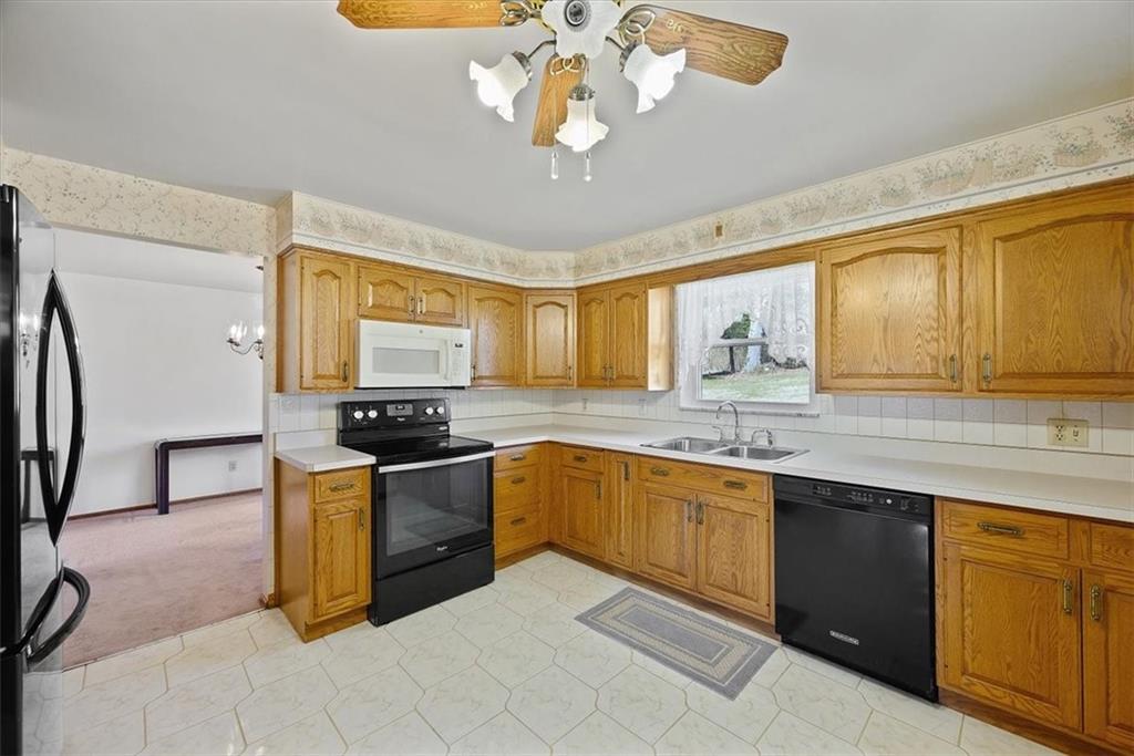 36 Diebold Road McKees Rocks, PA 15136 - Photo 7 of 20 a kitchen with stainless steel appliances granite countertop a stove a sink dishwasher and a refrigerator