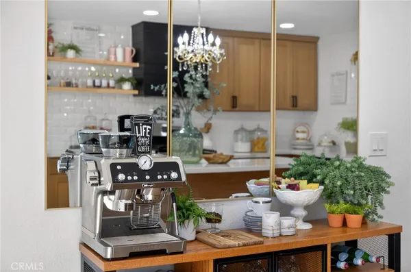 a kitchen with a table and chairs in it