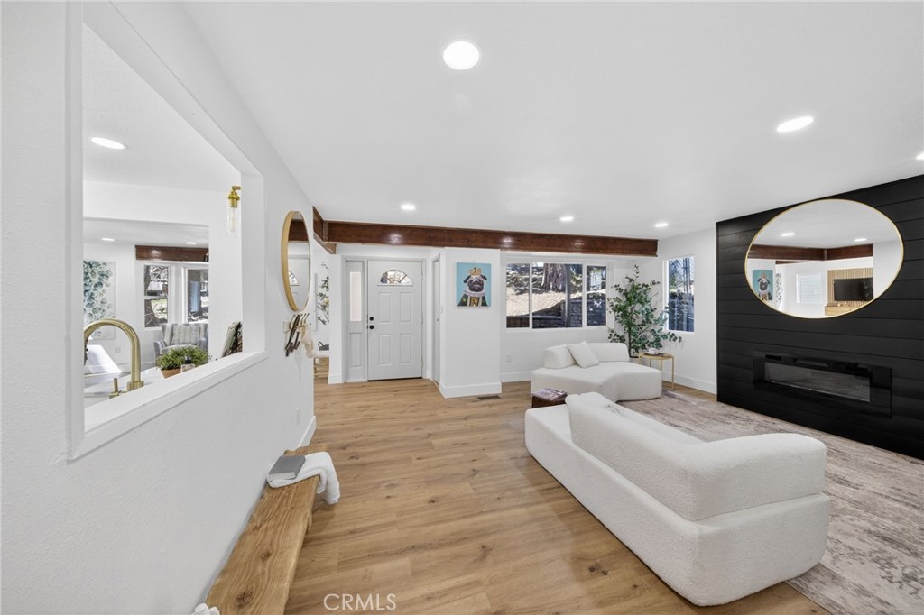 1171 Bear Springs Road Rimforest, CA 92378 - Photo 23 of 43 a living room with furniture and a large mirror